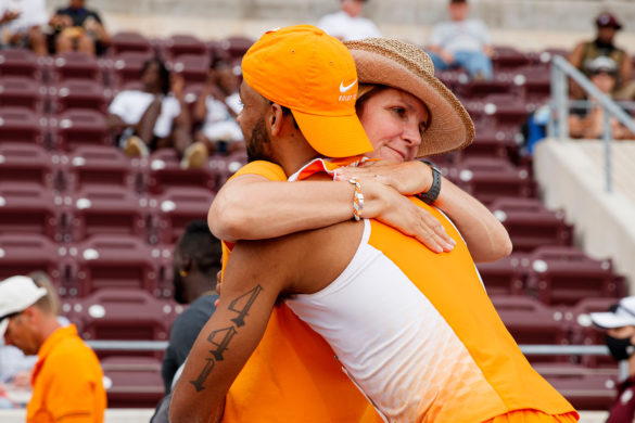 Beth Alford Sullivan hugs an athlete