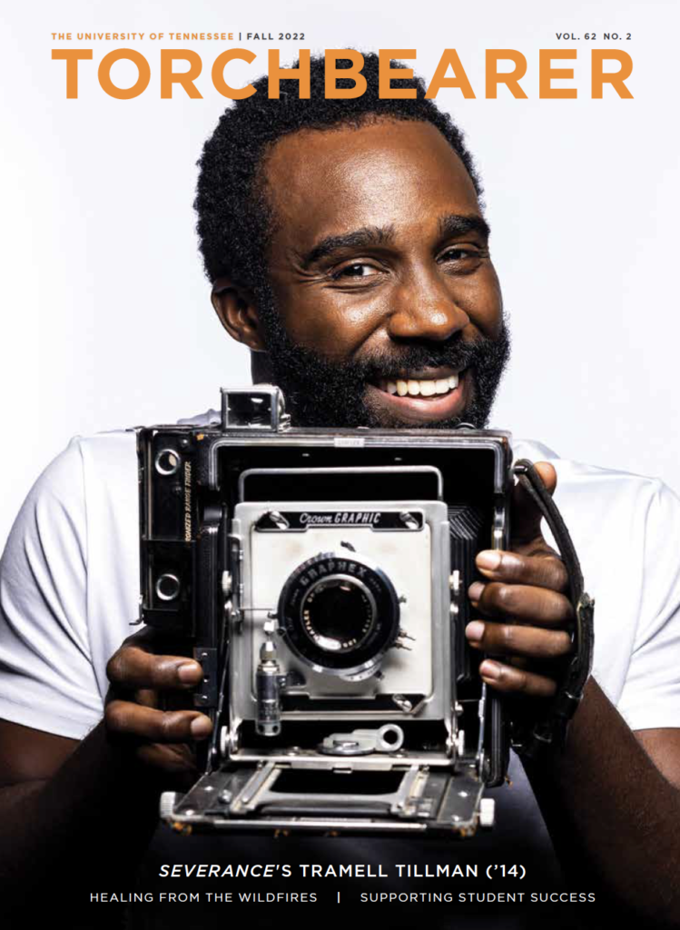 Tramell Tillman holds an old camera on the cover of Torchbearer magazine