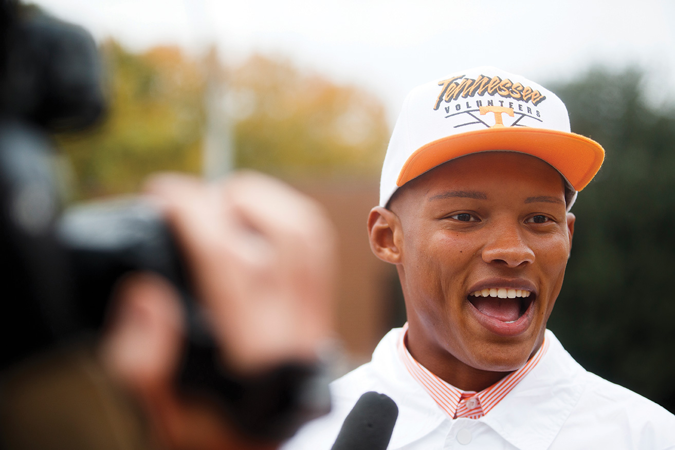 Josh Dobbs speaks into a microphone while being filmed