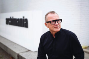 Memphis architect Barry Alan Yoakum, a man with short hair, glasses with heavy black frames, and a black shirt