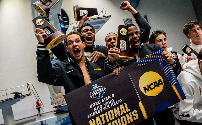 record-crooks_team Jordan Crooks and teammates celebrate following their relay win