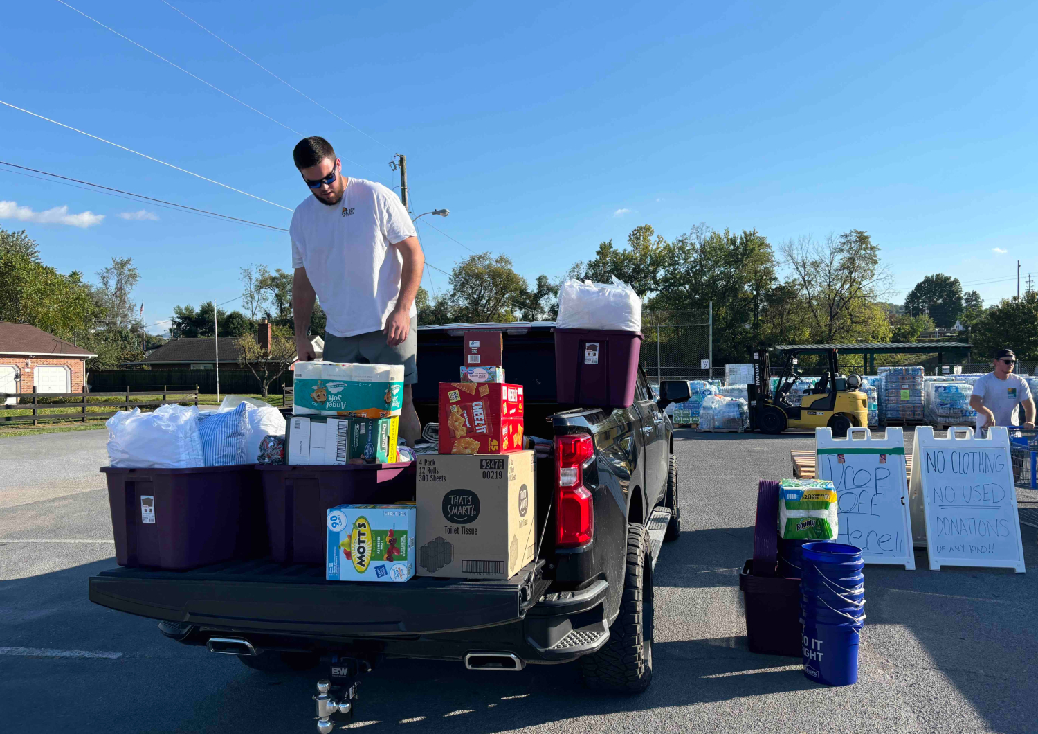 spirit-davisdelivers Dayne Davis unloads boxes of donations from the back of a truck